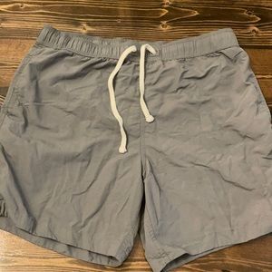 Grey men’s size large modern amusement swim trunks.
